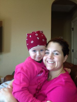 My wife and daughter getting the daughter ready for another day in the garage and trying to keep grease out of her hair.