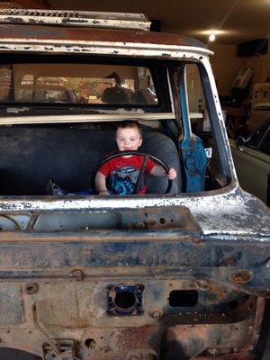 My son playing in the parts truck.