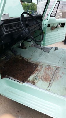 Driver's side floor panel showing water damage