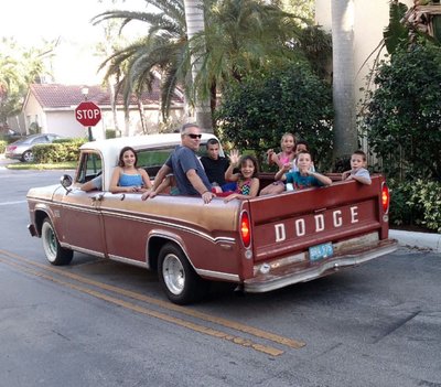 Taking the neighborhood kids for a Christmas ride.