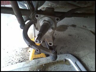 A small flat screwdriver, brass bristle brush and an entire can of Brakekleen.