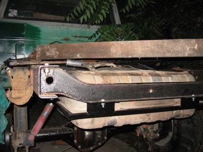 In this picture, the 2x4 above the tank is the height of the bed floor, so you can see about how high up in the frame I set the tank.