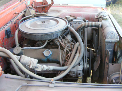 Here is the 383 with the factory air equipment. The truck has a slant six radiator in it. The outlet on the rad is on the wrong side, so someone made a really long pipe to connect it. I am going to have a new condenser made for the truck, and will get a proper big block radiator.